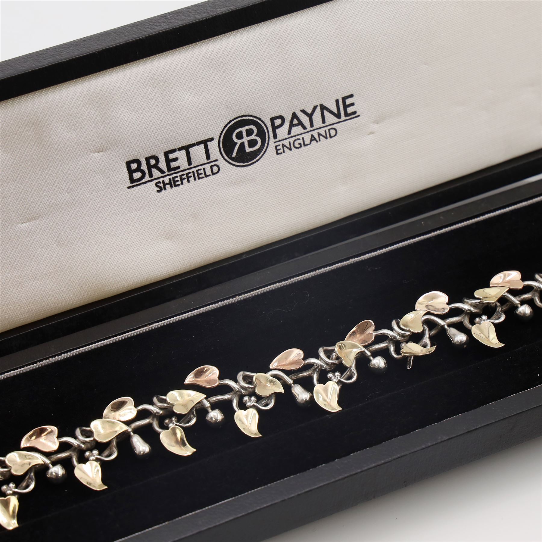 Brett Payne silver and 9ct gold fruiting vine necklace, seventeen links with alternating pears and apples and 9ct gold leaves, Sheffield 1998, boxed