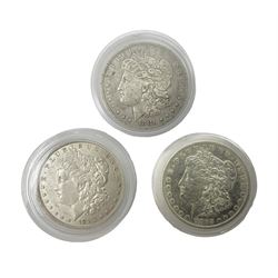 Three United States of America silver Morgan dollar coins dated 1881 O, 1882 and 1882 O