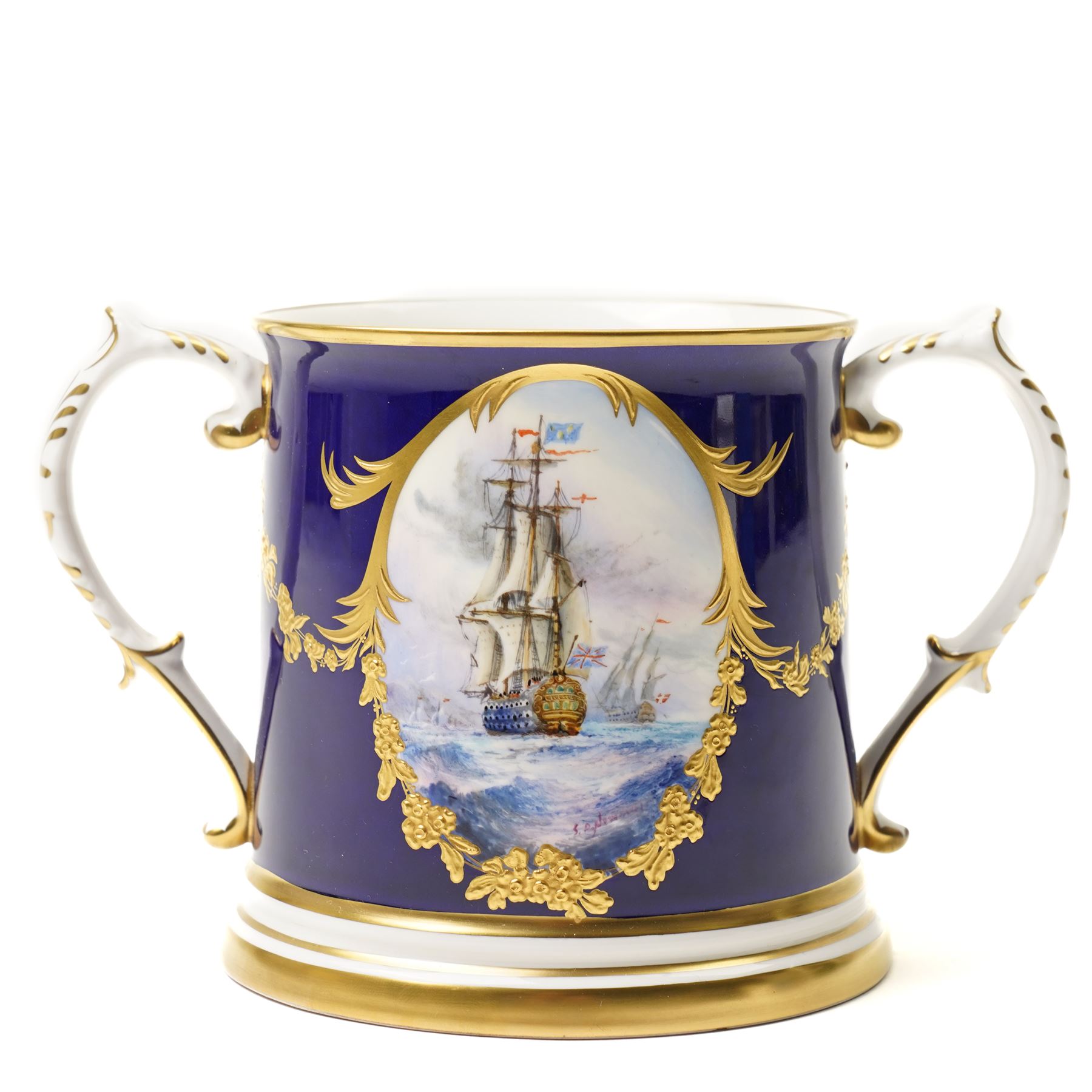 Lynton Porcelain Company loving cup, decorated with a British naval frigate, signed Stefan Nowacki, on a cobalt blue ground finely embellished in gilt enamel, printed marks to base, H11.5cm 