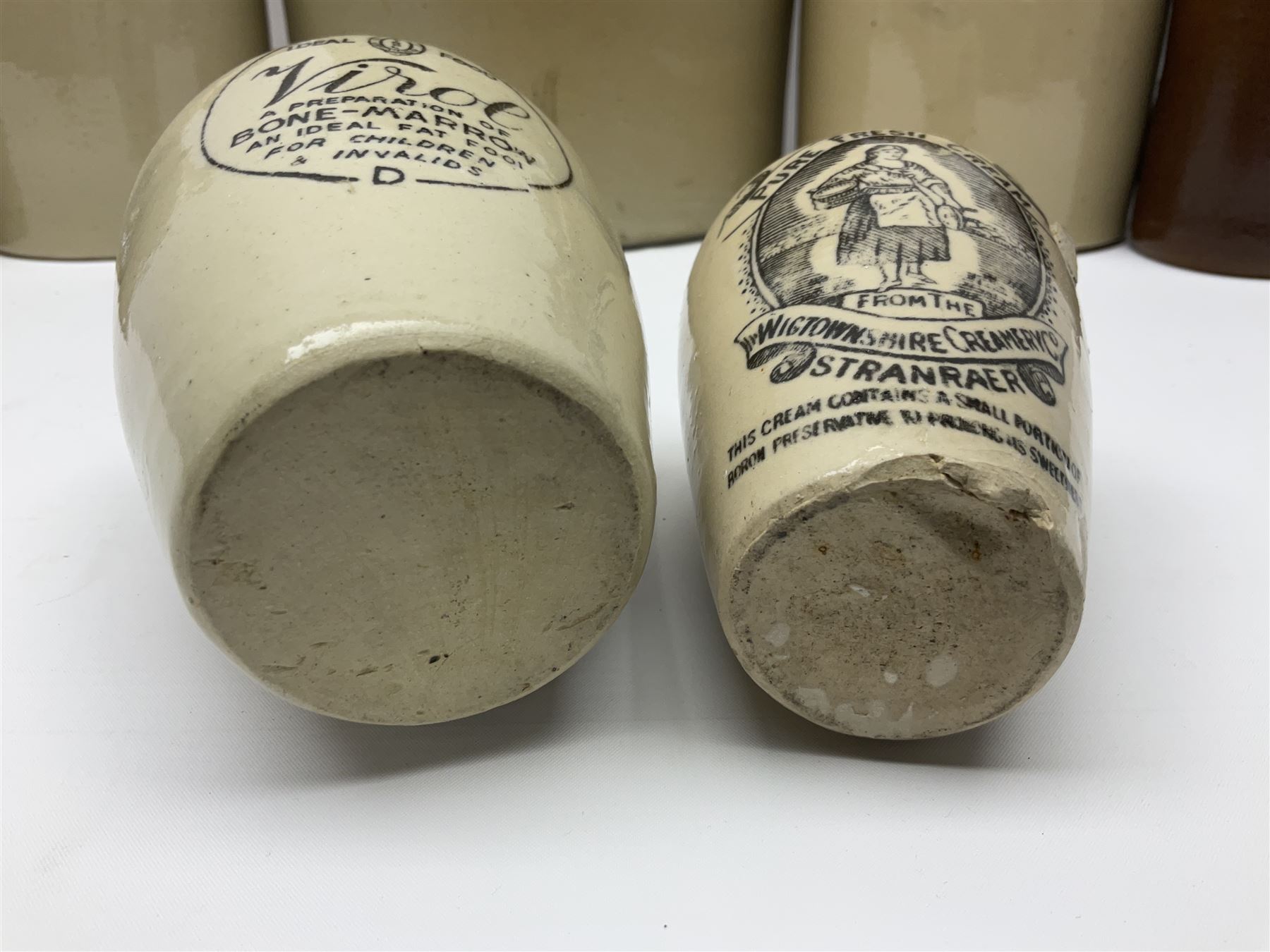 Large 2 gallon stoneware flagon, stamped 'John Soulby Wine Merchant Malton 2 Gall', together with a collection of similar stoneware jars and bottles, largest H40.5cm