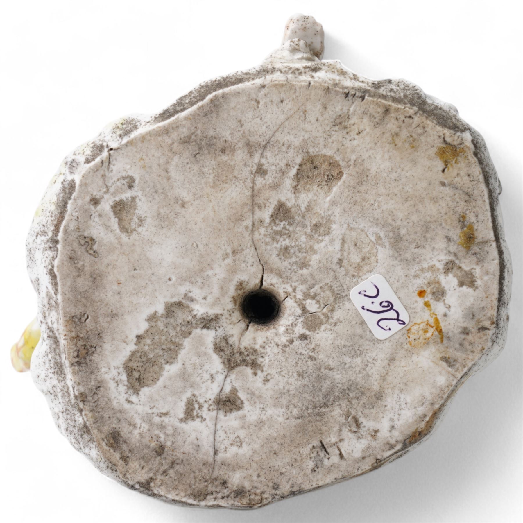 18th century possibly Staffordshire porcelain figure of Vulcan, adorned in classically draped robes, holding an urn and standing on a naturalistic base with volcanic flames H20cm