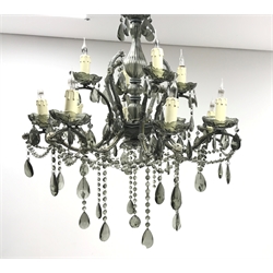  Large twelve light glass chandelier, baluster shaped central glass column supporting four short arms above a second tier of eight arms, each fitted with a candle effect bulb holder and grey glass drops, H78cm  