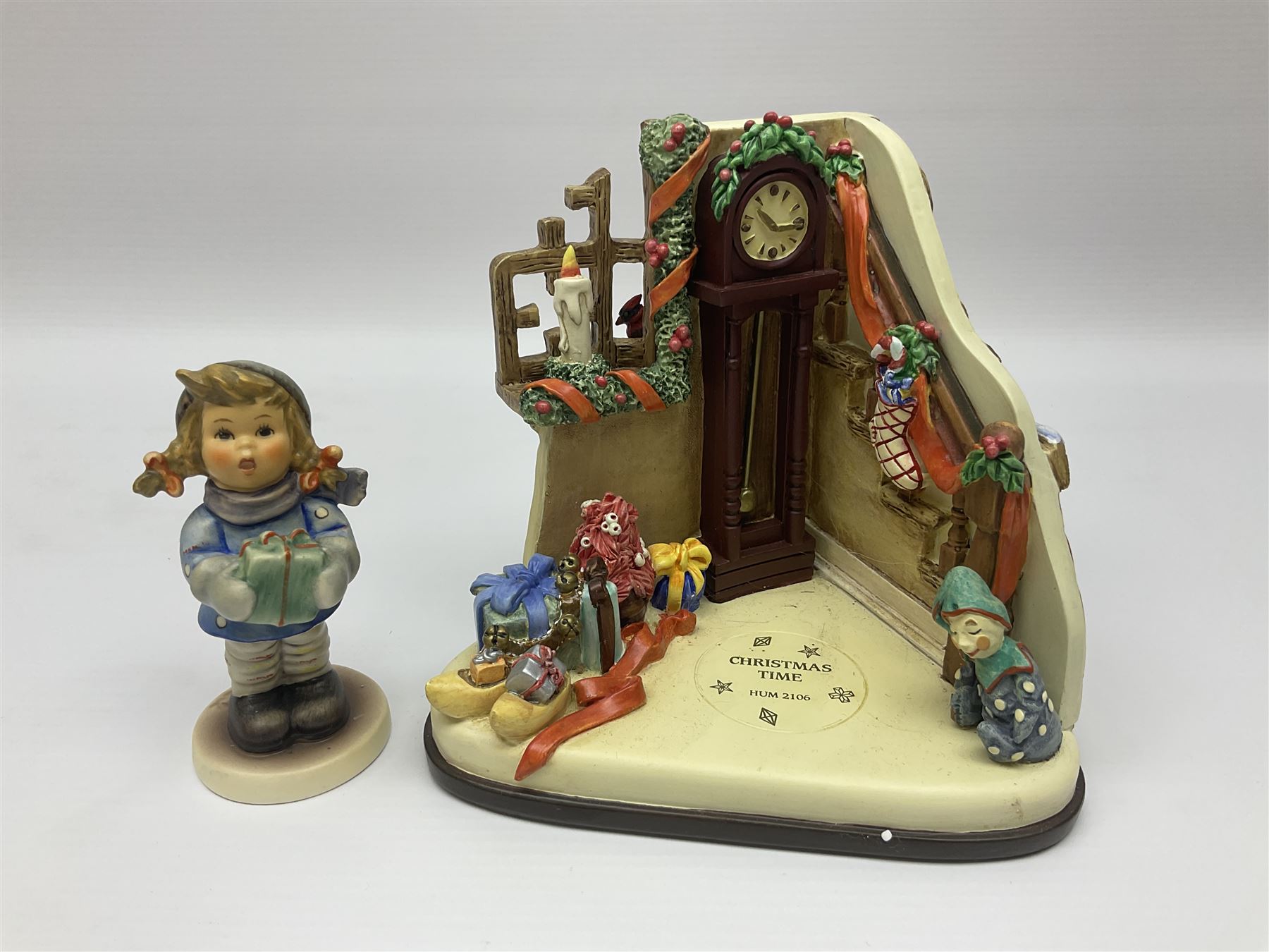 Eight Christmas Hummel figures by Goebel, to include Wintertime Chapel candle holder, Winter Fun, Christmas Morning, Christmas Time and Gingerbread Lane, tallest H21cm
