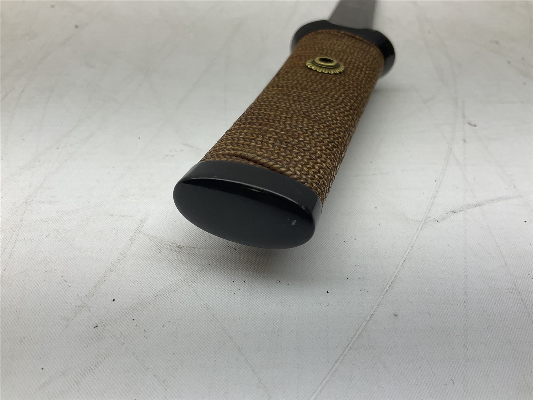 Japanese Tanto with 28.5cm steel blade and cord bound grip; in red spotted black lacquer saya containing a kogai knife with etched characters to the blade and ornate fern leaf and snake handle