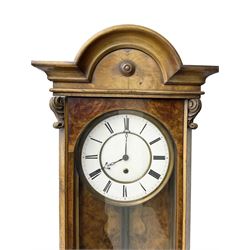 German - 19th century single train weight driven Vienna regulator in a figured walnut case, with a break arch top and ogee base, fully glazed door with canted corners and carving, two part enamel dial with Roman numerals and pierced steel hands, timepiece weight driven movement with a brass faced pendulum bob. 