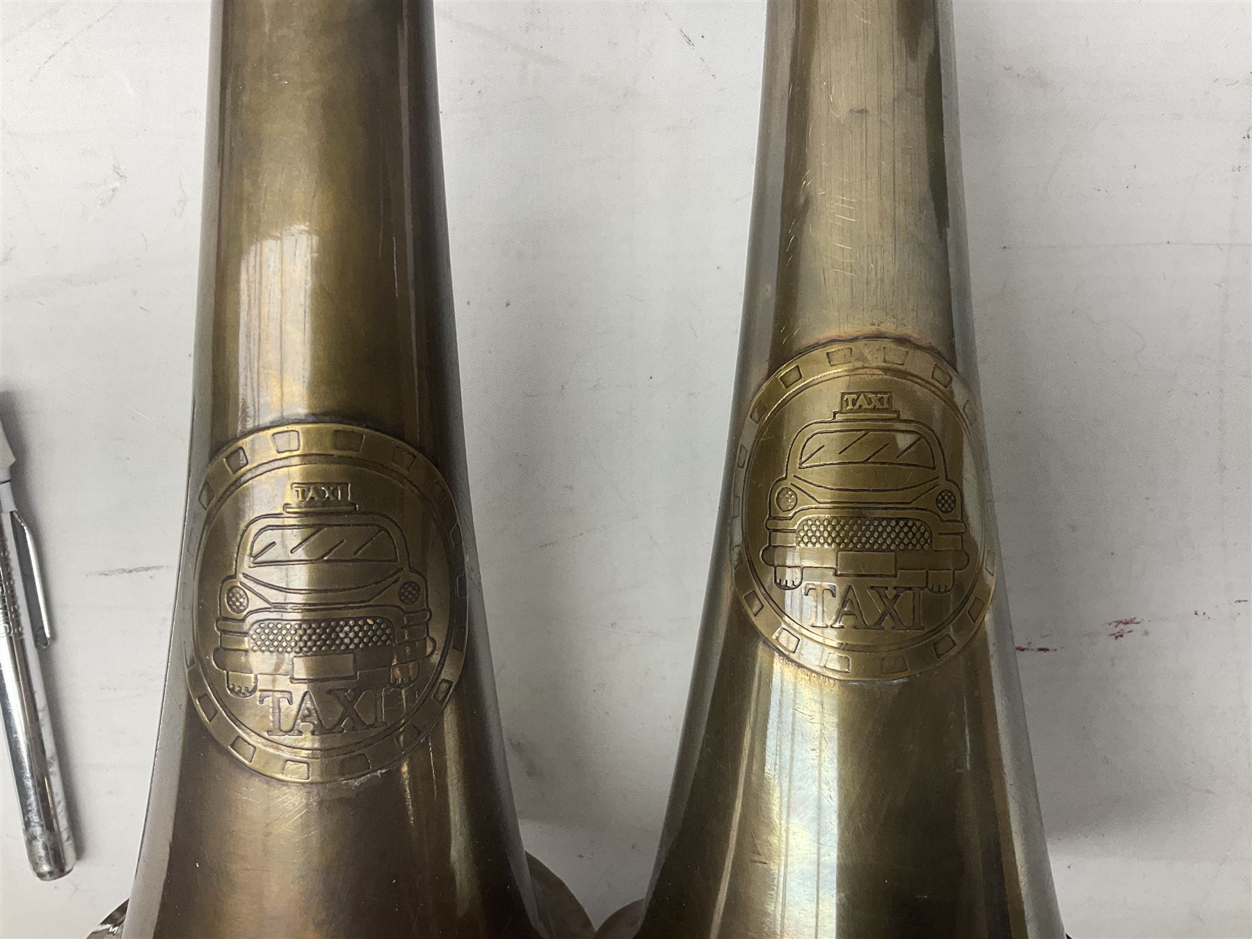 Bugatti cast iron sign with a red background, Shell Oil cast iron sign with gold background, together with Land Rover oil can, motorist warning lamp & torch tool kit and other motoring items 