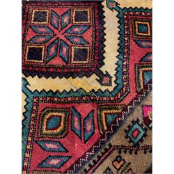 Persian red ground runner, set with seven linked geometric medallions, decorated all over with geometric stylised plant and flower motifs 