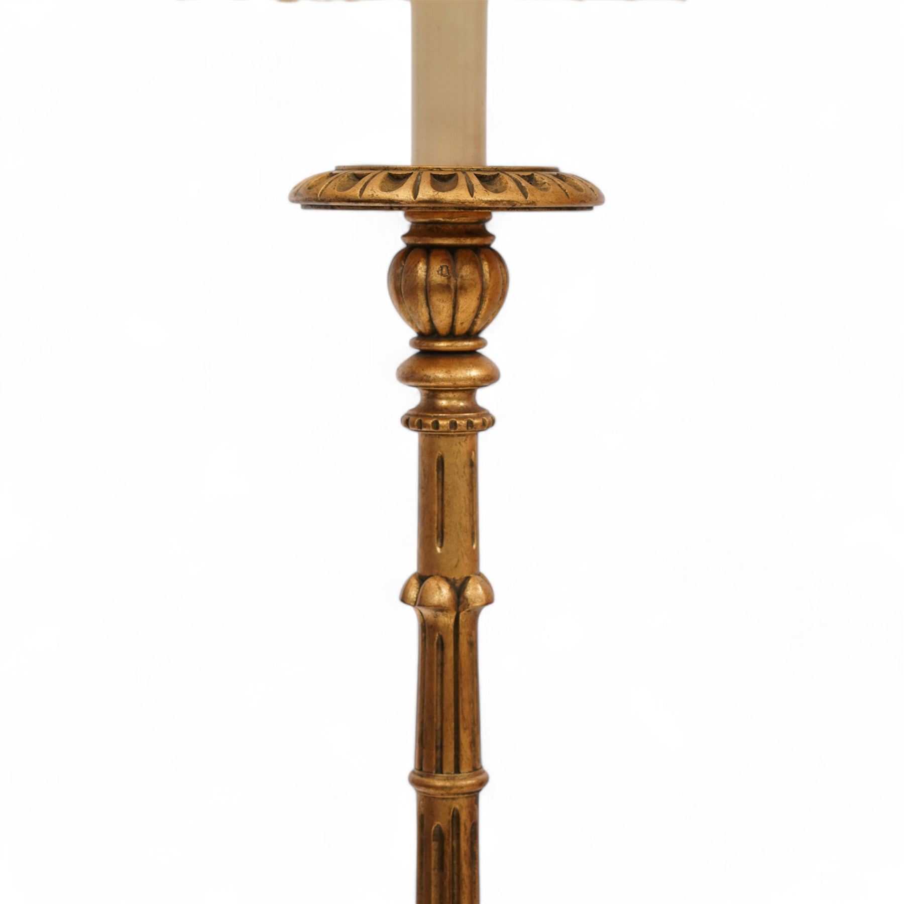 Italian design giltwood pricket stick standard lamp with shade, turned and fluted column on circular acanthus leaf carved base