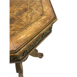 Mid-20th century figured walnut Italian design centre table, octagonal quarter veneered top with cross banding and moulded edge, the skirt decorated with scrolling foliage gilt metal mounts, on turned pedestal mounted with gilt acanthus leaves, quadruple splayed supports with further acanthus leaf decoration