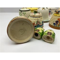 Clarice Cliff for Wilkinson Ltd Crocus Bizarre beehive honeypot painted in the Crocus pattern, together with two beehive Beswick honey pots, Poole square honey pot etc (14)