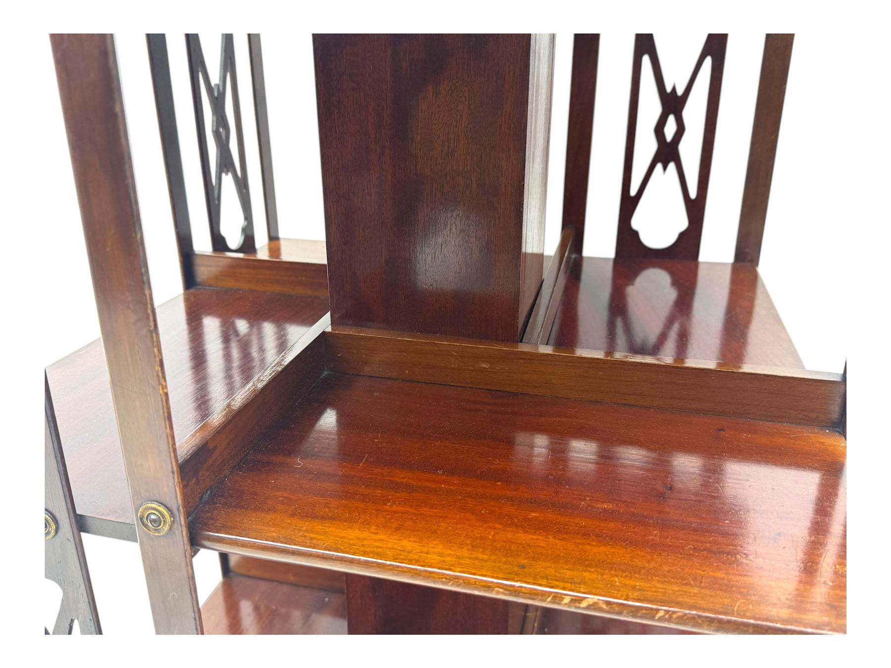 Edwardian inlaid mahogany revolving bookcase, shaped square moulded top with central motif and satinwood band, two tiers with pierced vertical splats, on swivel action base with ceramic castors