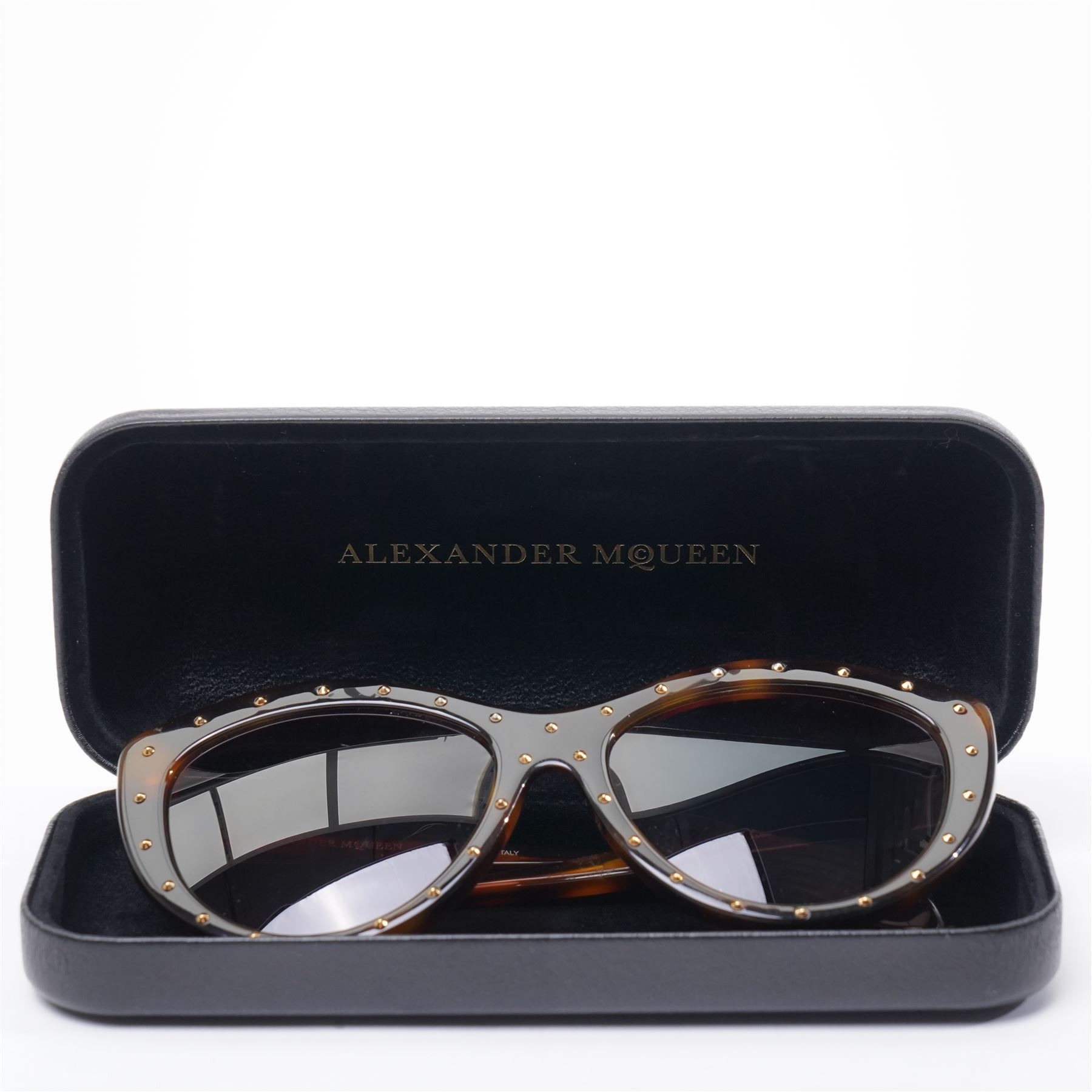 Alexander McQueen - pair of oversized sunglasses, with tortoiseshell-effect acetate frames and gradient tinted lenses, the fronts studded with gold-tone metal rivets, the arms signed ‘Alexander McQueen’, with original hard case and box