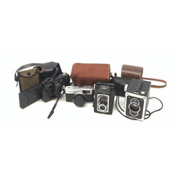 A group of cameras, to include an Olympus Trip 35, a Vest Pocket Kodak Model B, a Minolta H-Matic S, etc. 