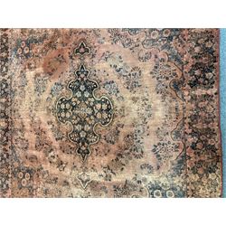 Persian rug, shaped central medallion surrounded by trailing branch and flower heads, floral design border with signature panel  