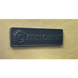 Kevin Charles American walnut serpentine chest, five graduating drawers, half turned fluted column carving, turned supports 