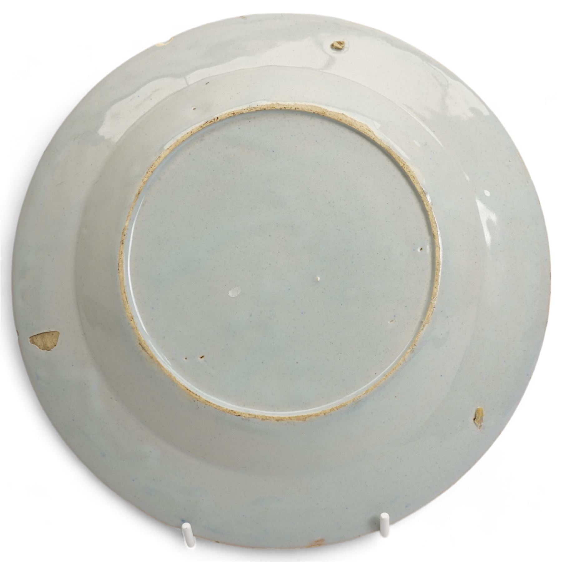 18th century Delft plate decorated with a Chinoiserie landscape