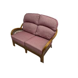 Three piece cane and bamboo conservatory suite - two seat sofa (W140cm, H104cm, D93cm), and pair matching armchairs (W80cm), with loose cushions upholstered in purple fabric