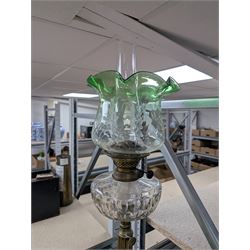 Oil lamp with frilled green glass shade, glass reservoir, upon upon corinthian column with stepped circular base, H74cm