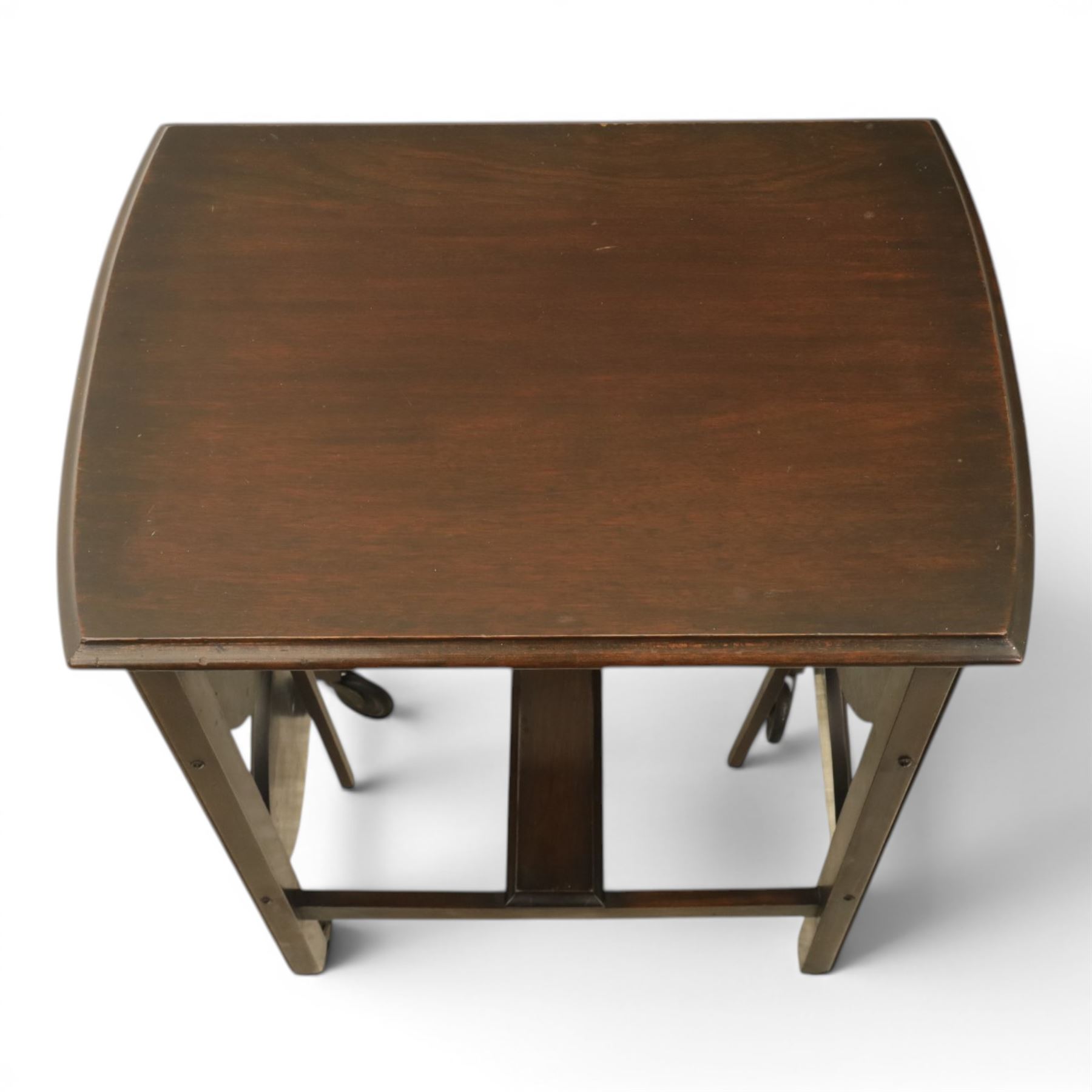 Early 20th century side table with double cake stand, rectangular moulded top, cake stands either side with support, raised on square legs terminating in castors