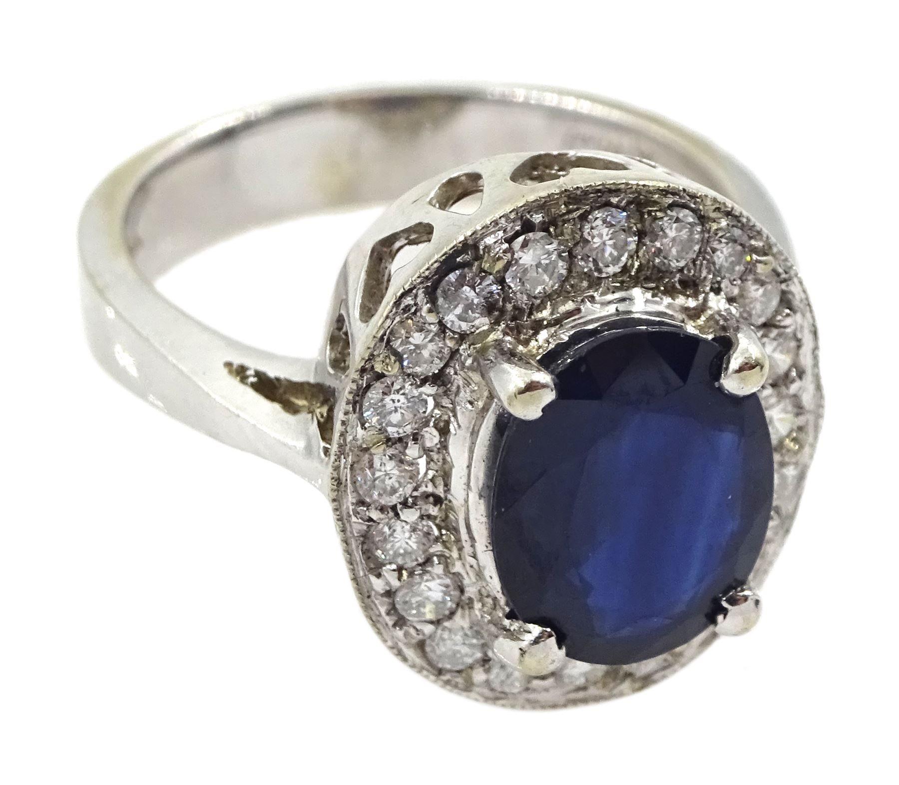 White gold oval sapphire and diamond cluster ring, stamped 14K, sapphire approx 2.00 carat