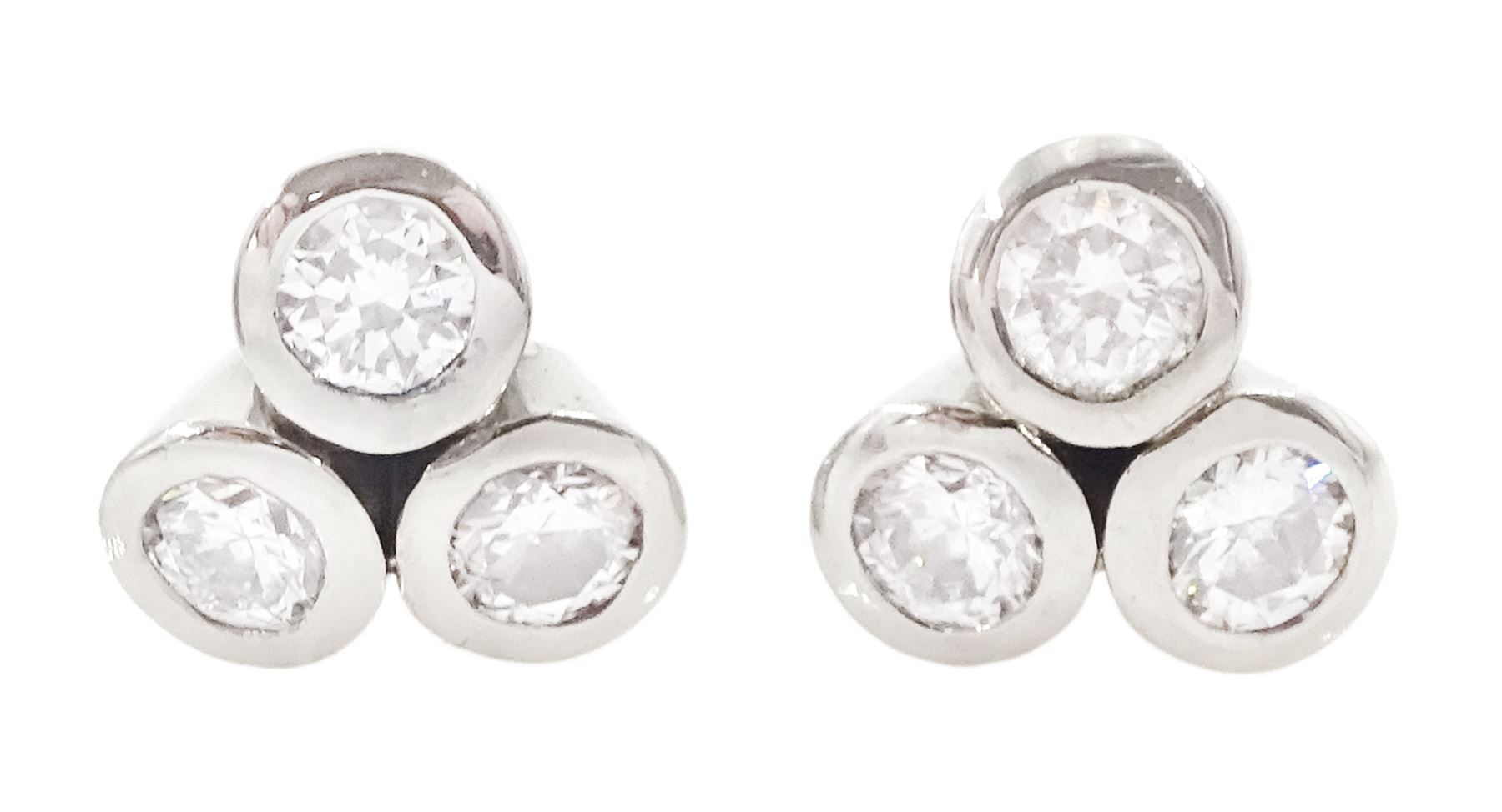 Pair of white gold bezel set, round brilliant cut diamond cluster stud earrings, total diamond weight approx 0.65 carat
