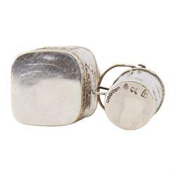 Late 19th century German Hanau silver miniature novelty scuttle, of cylindrical form with side handle and swing handle, the body impressed with figural genre scene, with Hanau marks for Karl Kurz, and hallmarked Samuel Boyce, Chester 1902, with 'F' foreign import mark, not including handle H3.5cm, together with a late 19th century German Hanau silver miniature novelty tea caddy, of rounded cube form, the body impressed with figures at work in a countryside setting, with Hanau marks for Neresheimer & Sohne, and hallmarked B Muller & Son, Chester import 1907, and marked 925, H5cm