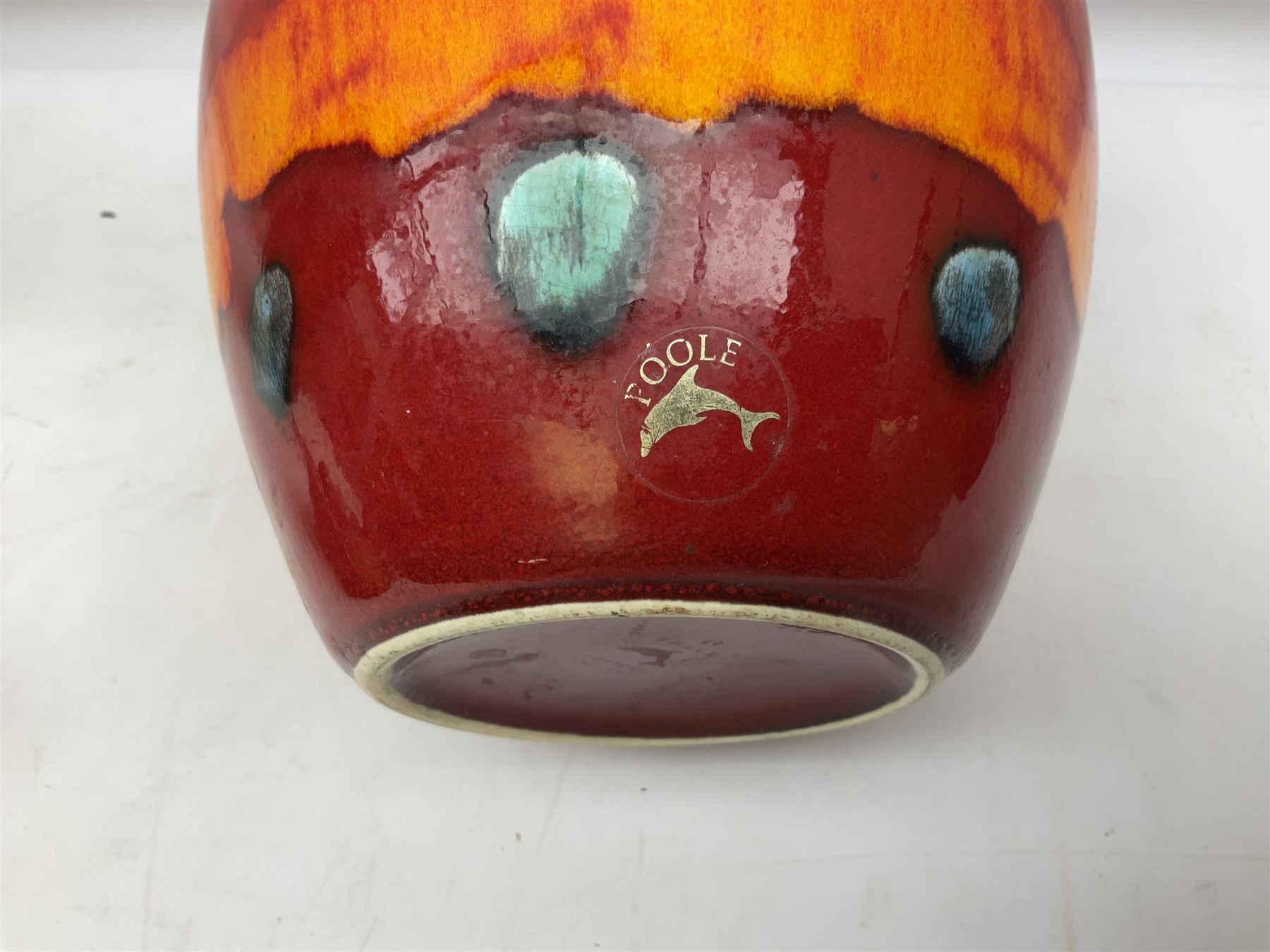 Collection of Poole Pottery, comprising charger and vase in Volcano pattern and a duck figure in a similar pattern 