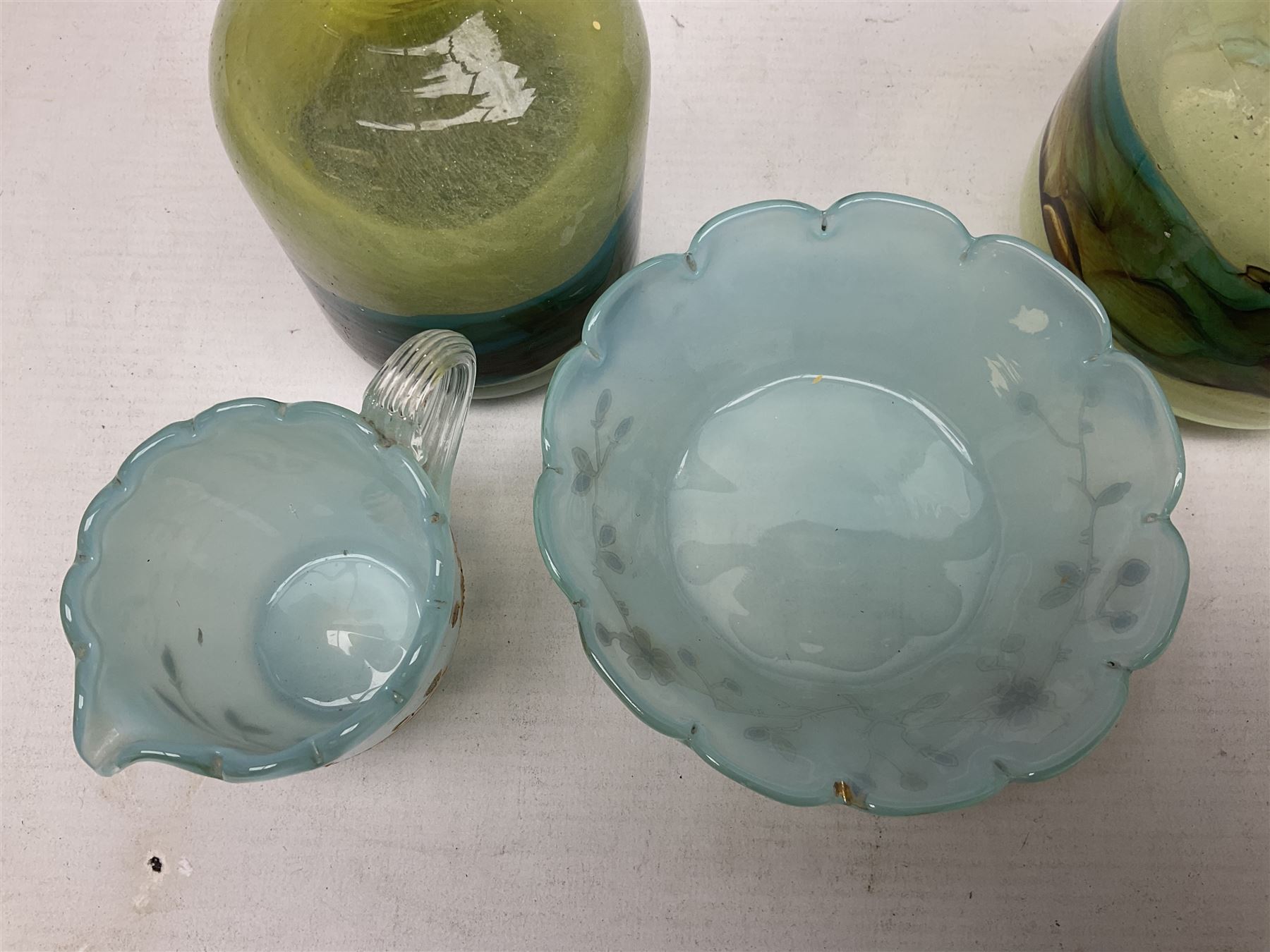 Mdina sea and sand glass vase, of cylindrical form, decorated in green, turquoise and brown, and matching vase, both unmarked together with a glass bowl and jug with gilt decoration 