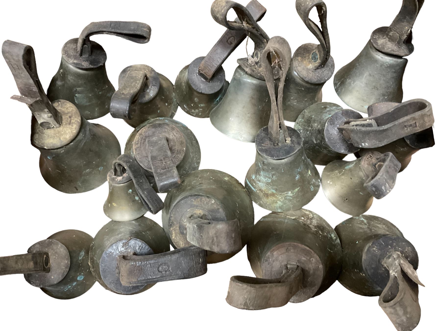 Collection of 44 late 19th century brass church/musical handbells with leather straps by James Shaw Brothers of Bradford and bells marked G.W. possibly cast by the George Welch bell foundry, London.
The number of bells and stated notation, some at different pitch, is as follows;
5 “C”, 4 “D”, 5 “E”, 4 “F”, 5 “G”, 5 “A”, 6 “B”.
3 “F#”, 4 “C#”,1 “Db”, 1 “G#”, 1”A#”.
Two of the bells are minus their clappers and one bell has no leather strap.
