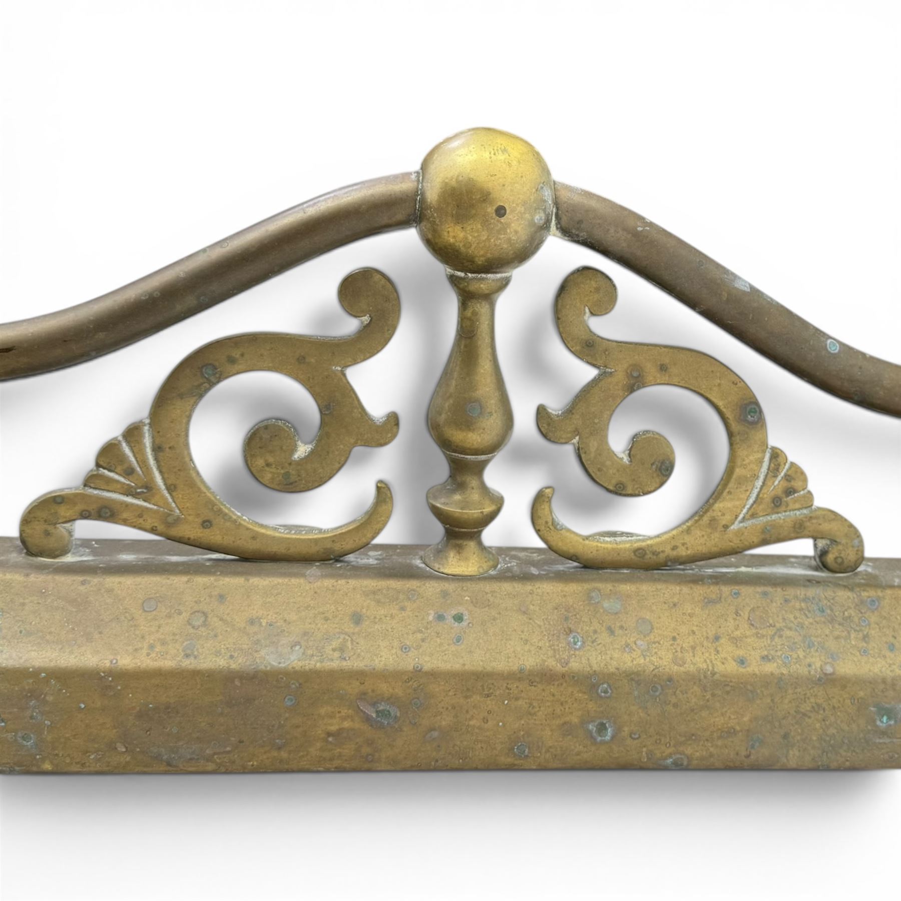 Three 20th century brass fenders, two with pierced Art & Crafts design rails, largest W156cm, D 45cm 
