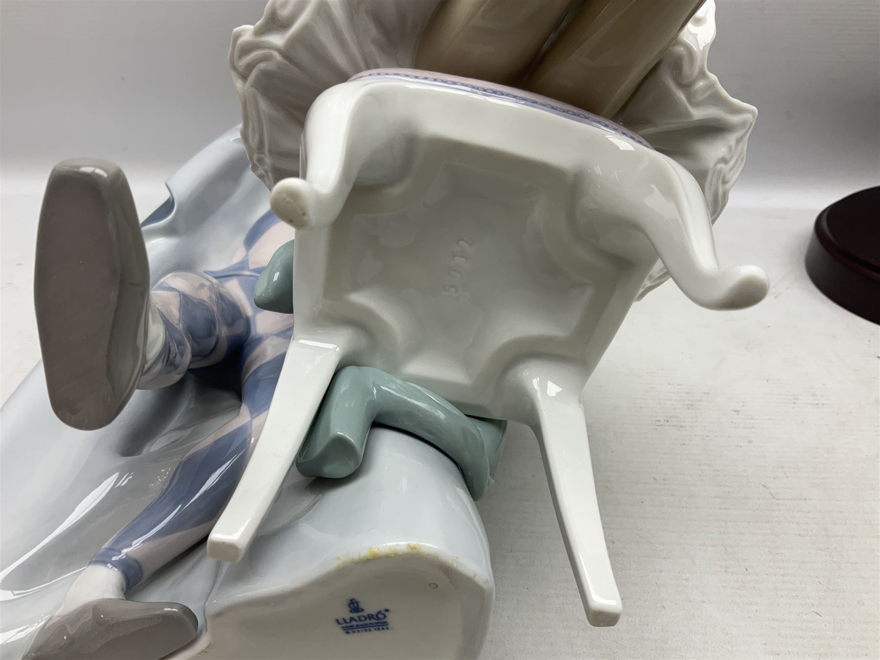 Lladro figure, Jester Serenade, modelled as a ballerina with bouquet of flowers seated before a jester playing the violin, limited edition 2541/3000, sculpted by Antonio Ramos, no 5932, with original box, year issued 1993, year retired 1994, H37cm