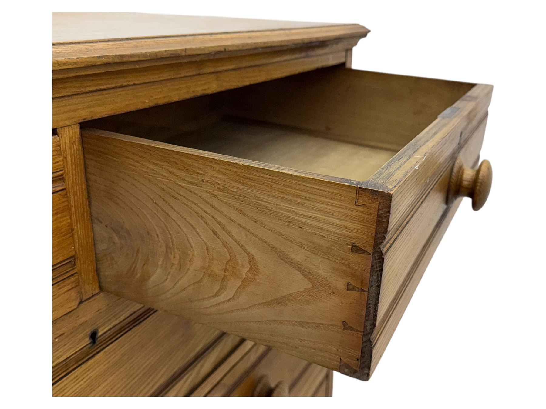 Late 19th century ash chest, fitted with two short and four long drawers, turned wooden handles