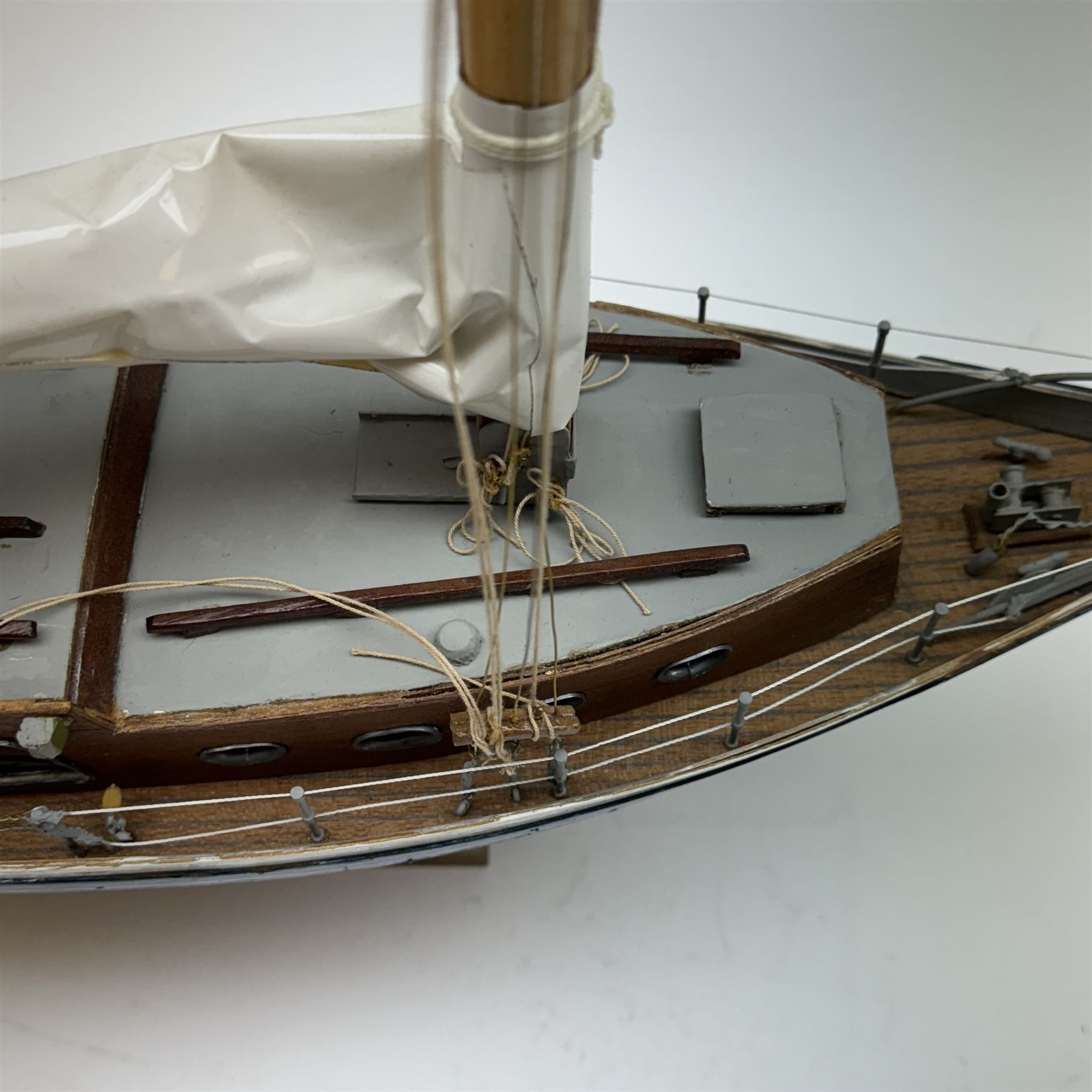 Scratch built model yacht 'Rue de la mer', with painted blue and white hull, with acrylic case, model H67.5cm