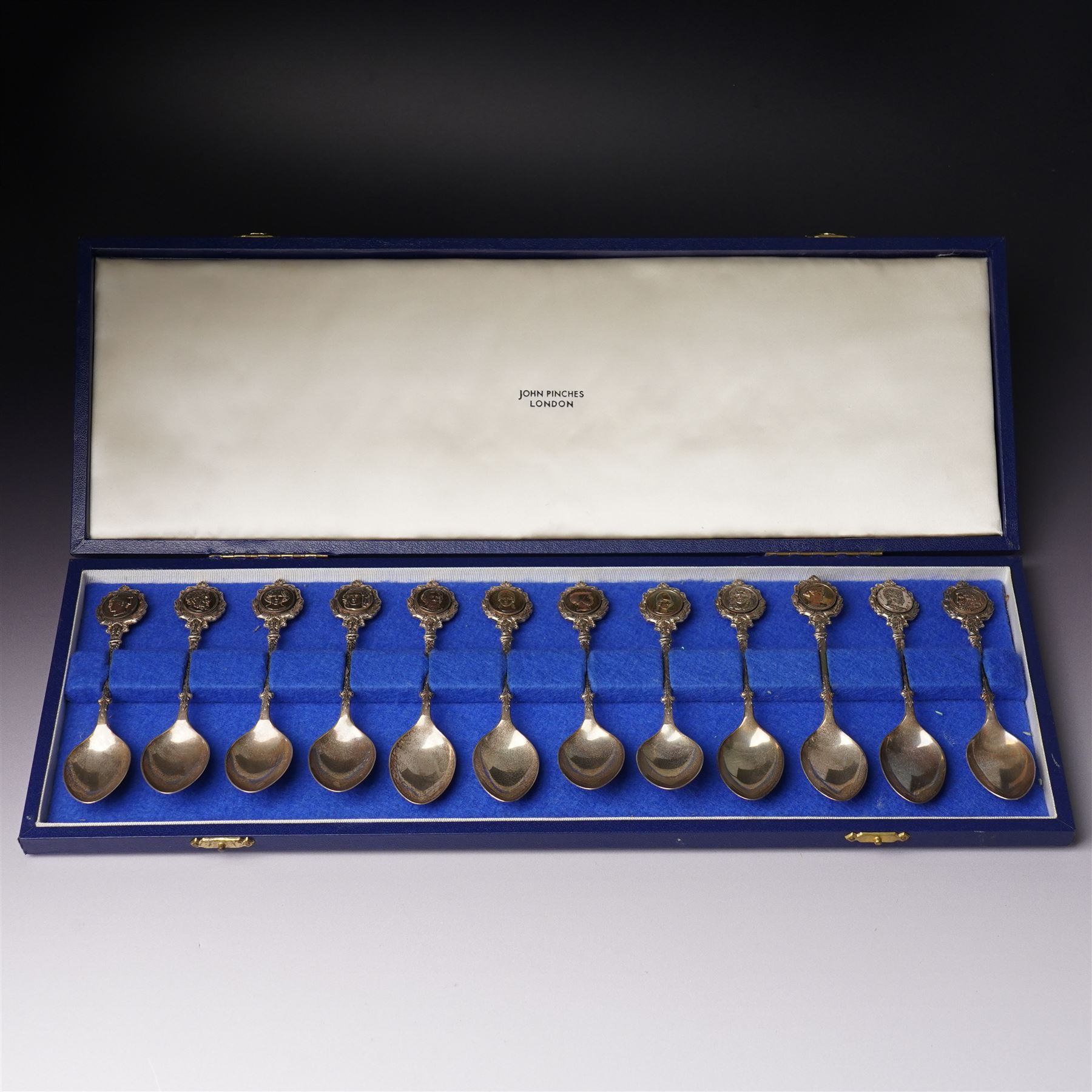 'The Twelve Roman Spoons' a set of twelve silver spoons each with the head of a Deity in fitted case London 1971 Maker John Pinches