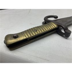 French Model 1866 Chassepot bayonet with 57cm curving fullered steel blade dated 1873 No.L63963; in steel scabbard with conforming number L71.5cm overall; and French St. Etienne Gras bayonet dated 1878 No.K10674 in steel scabbard numbered 79437 (2)