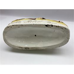 19th century Staffordshire figure of Robert Peel, titled 'Sir Robert Peel', modelled on horseback, atop an oval plinth base featuring a naturalistic and floral design, H30cm 