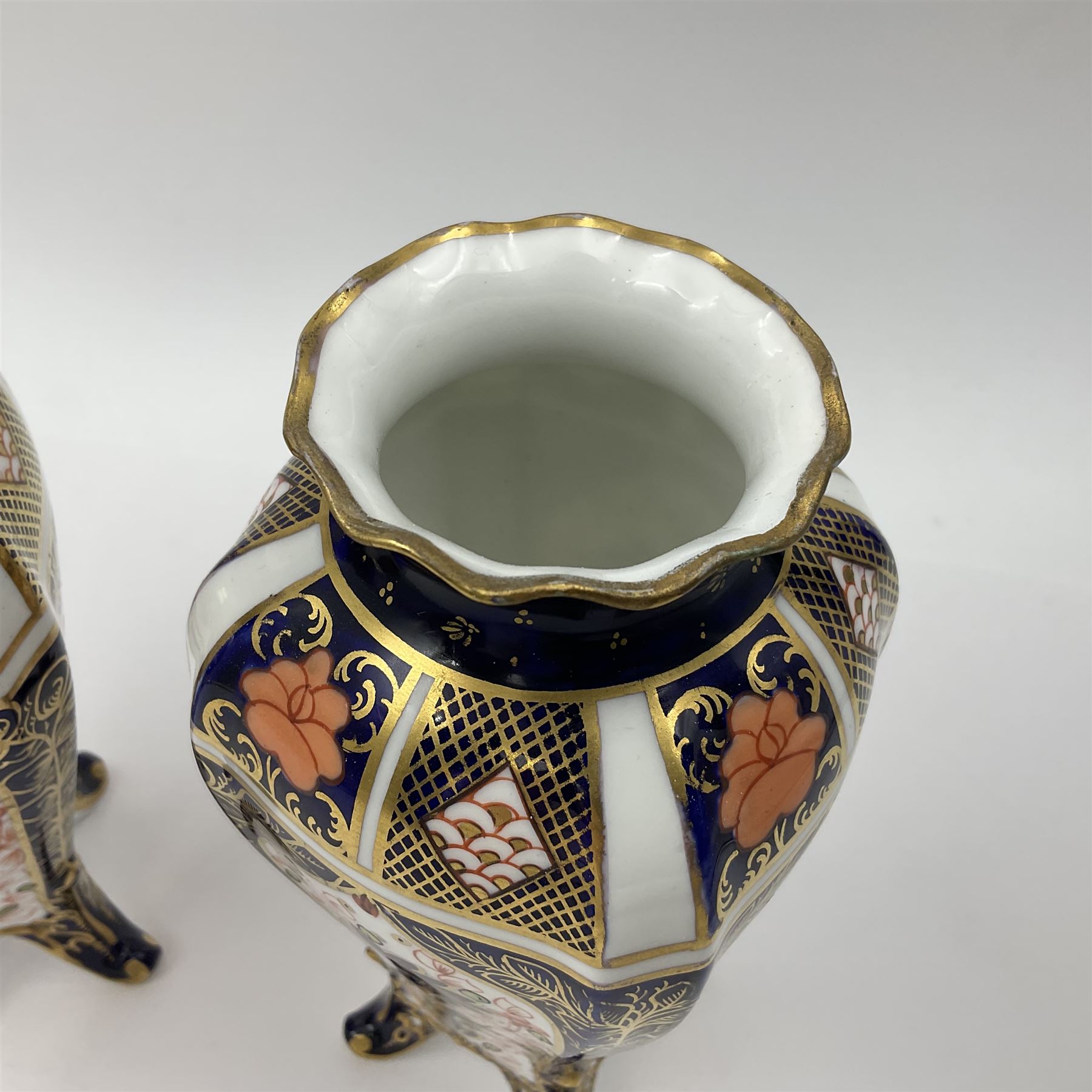 Pair of early 20th century Royal Crown Derby Imari 1128 pattern vases, of tapering straight sided form with waisted neck and frilled rim, upon four splayed feet, with printed and painted marks beneath including illustration date codes for 1911 and 1920, H17cm