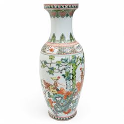 Three Chinese 20th century famille rose vases, of baluster form, decorated with traditional motifs and figures, together with another famille vert example decorated with peacocks, largest H36.5cm (4)