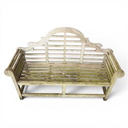Lutyens design weathered teak garden bench with matching two-tier table, the bench with shaped arched and slatted back over rolled arms and slatted seat