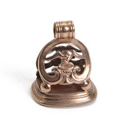 Late 18th/early 19th century 9ct gold fob seal, the carnelian matrix engraved with coat of arms, depicting a shield surmounted by a bird with foliage within its beak, within a scrolling mount detailed with a bird drinking from a chalice, H3.5cm 

Provenance: By family descent from the Chichesters of Arlington Court, Devon; from the collection of Andrew Chichester Everitt.