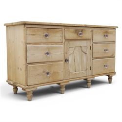 Victorian waxed pine farmhouse dresser, featuring seven drawers with central cupboard, mou...