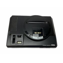 1990s Sega Megadrive 16bit games console with five games comprising Sonic the Hedgehog, Fifa International Soccer, Mickey Mouse Castle of Illusion, MicroMachines 2 Turbo Tournament and 1994 Lillehammer Winter Olympics, boxed with instructions