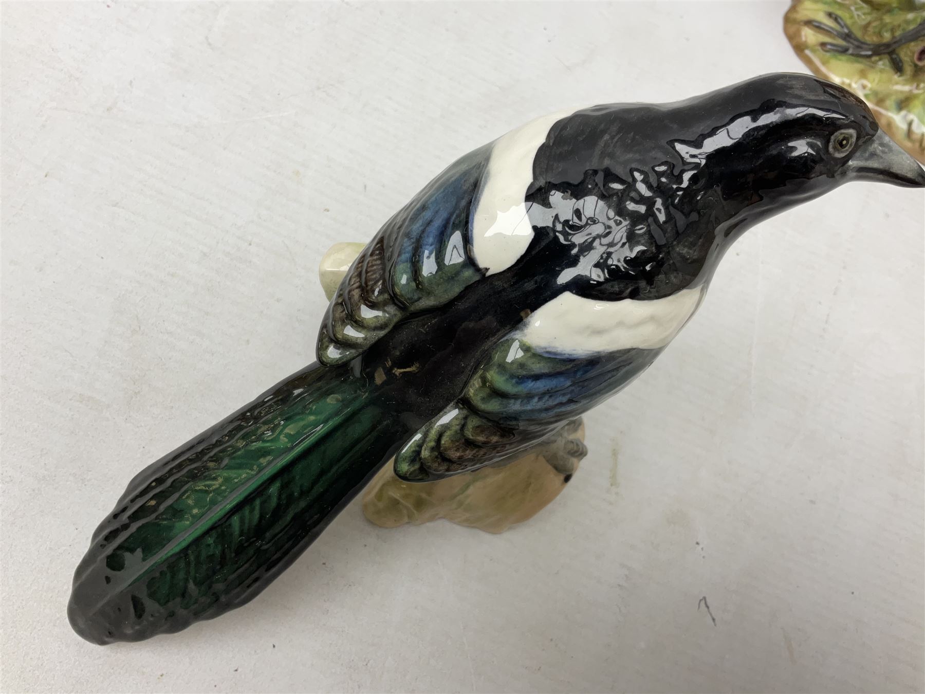 Three Beswick figures of birds, comprising pheasant no 1225, magpie no 2305 and woodpecker 1218, all with impressed marks beneath, tallest H22cm