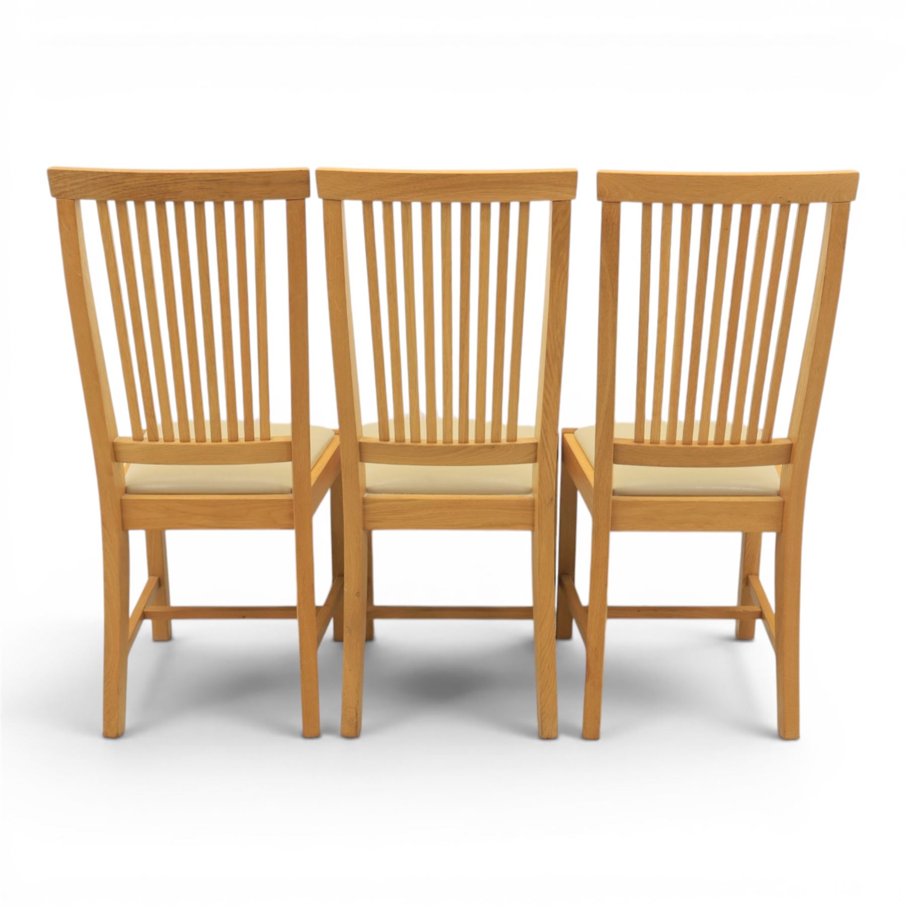 Contemporary oak dining extending table and set of six chairs, with additional leaf  extending to 182cm, chairs with cream upholstered seat