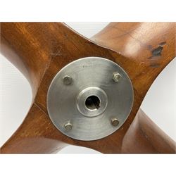 British World War II era laminated wooden four-bladed generator propeller, late 1930s-40s, used to power a drogue winch used by a target tug aircraft; marked with DRG drawing number T29505-2-4 N760 on the hub and impressed circle mark 'P.M.P.W. 1'; light weight four plank mahogany laminate with 9.5cm diameter metal plates mounted to front and rear faces of hub for 15mm shaft; one plate marked T29504-2/198 D91cm; together with a modern reproduction brass edged mahogany two-blade propellor L