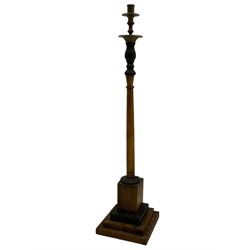 Pair of beech and ebonised wood candle stands, brass fittings