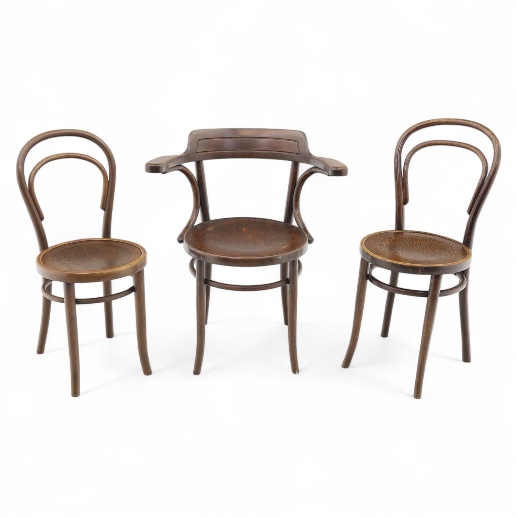 Set of three bentwood café chairs in the manner of Thonet, including a pair of side chairs (W 37cm, D 45cm, H 86cm) and a matching armchair (W 70cm, D 46cm, H 81cm), each with pressed seat decoration and continuous loop backrest