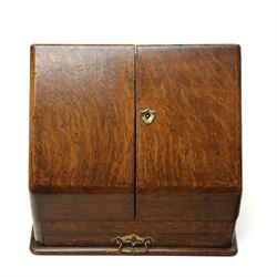 Victorian oak stationery cabinet, the two-door front opening to reveal compartmentalised interior, single drawer to base, H27cm W31cm 