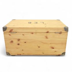 Pine storage trunk, of rectangular plank construction with metal corner protectors and stencilled lettering ‘LEB’ to front and lid