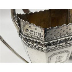 Victorian silver four piece tea service, comprising teapot, teapot stand, twin handled open sucrier and milk jug, each of octagonal form with foliate bud border and engraved decoration including crest to canted panels, and vacant panels, the teapot with ivory finial to the hinged cover and later wooden handle, hallmarked Edward Barnard & Sons Ltd, London1896, teapot including finial H15cm, milk jug including handle H16cm, teapot stand W11.5cm

This item has been registered for sale under Section 10 of the APHA Ivory Act